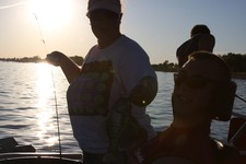 Hitting the crappies hard before sunfall. Great guides, great fishermen.